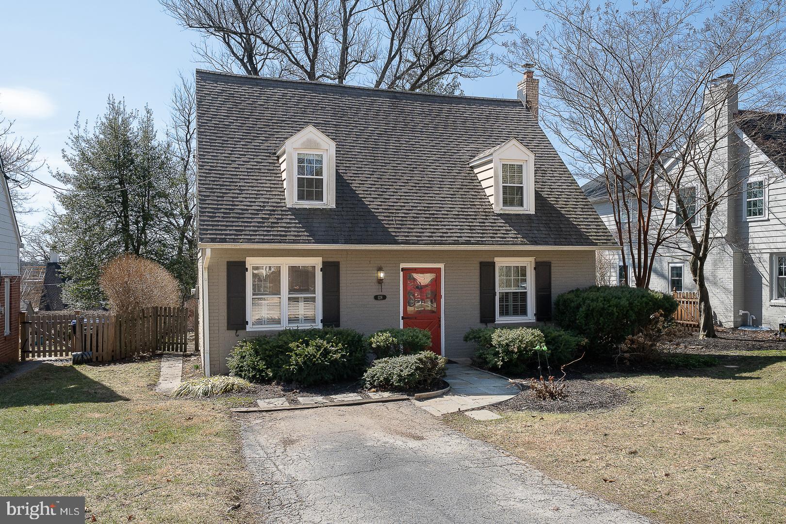128 Homestead Road Wayne, PA 19087 - Photo 1 of 30 a front view of house with yard and trees around