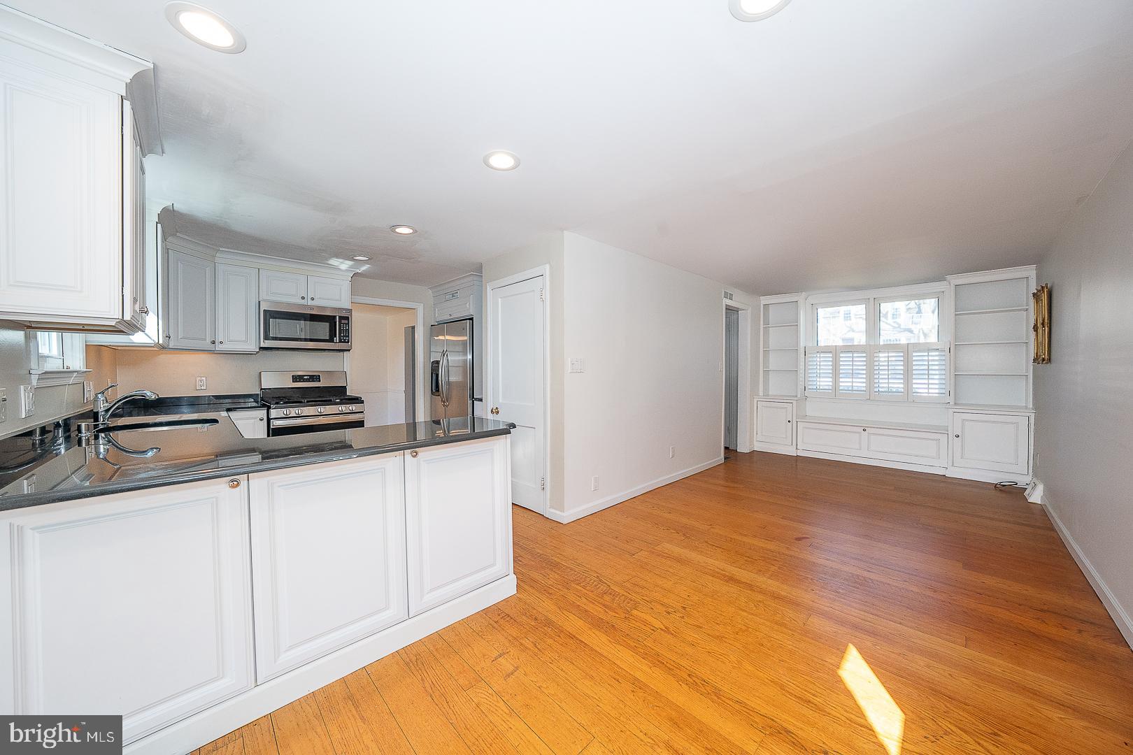 128 Homestead Road Wayne, PA 19087 - Photo 13 of 30 a kitchen with granite countertop a sink stainless steel appliances and cabinets