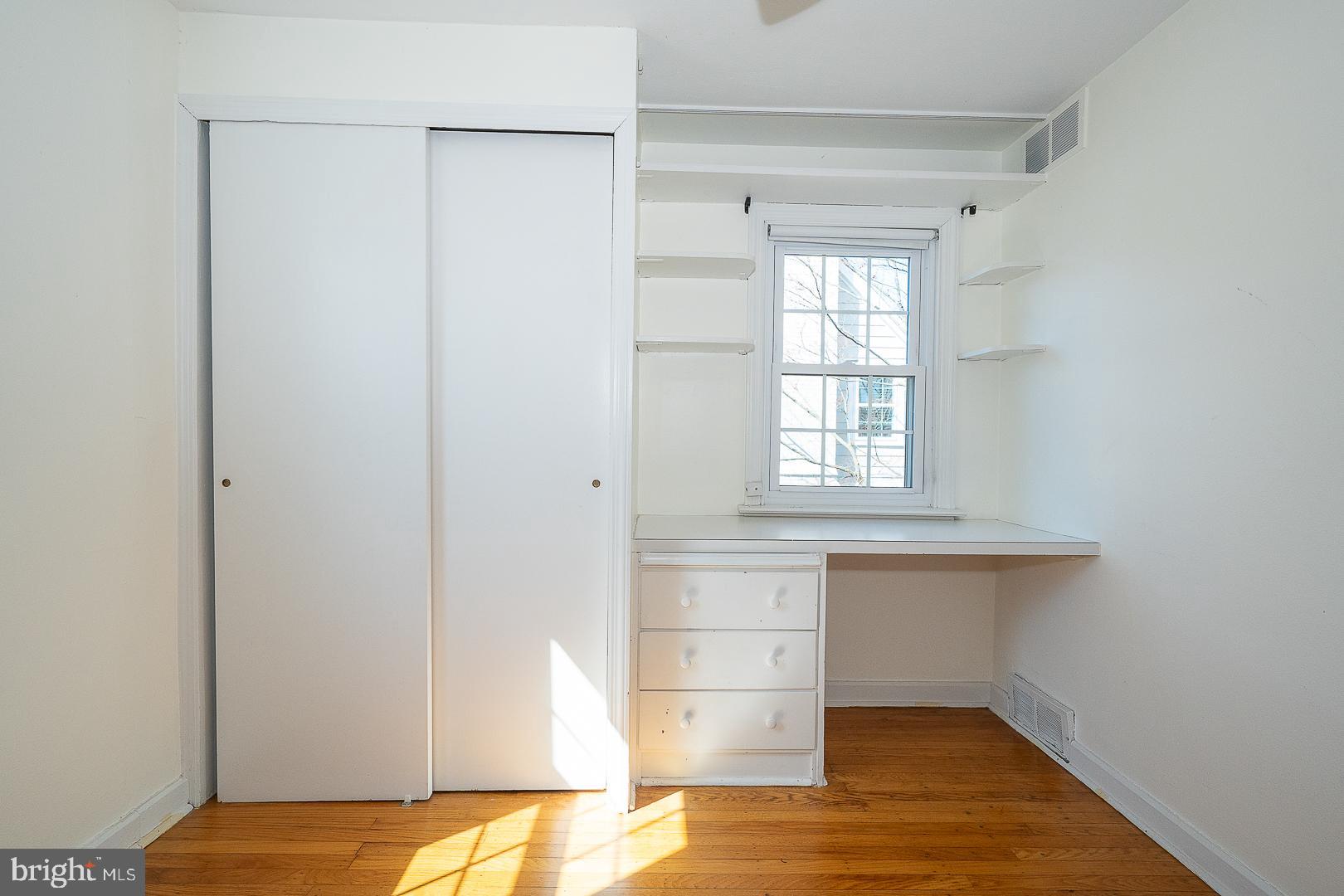 128 Homestead Road Wayne, PA 19087 - Photo 19 of 30 a view of empty room with wooden floor and fan