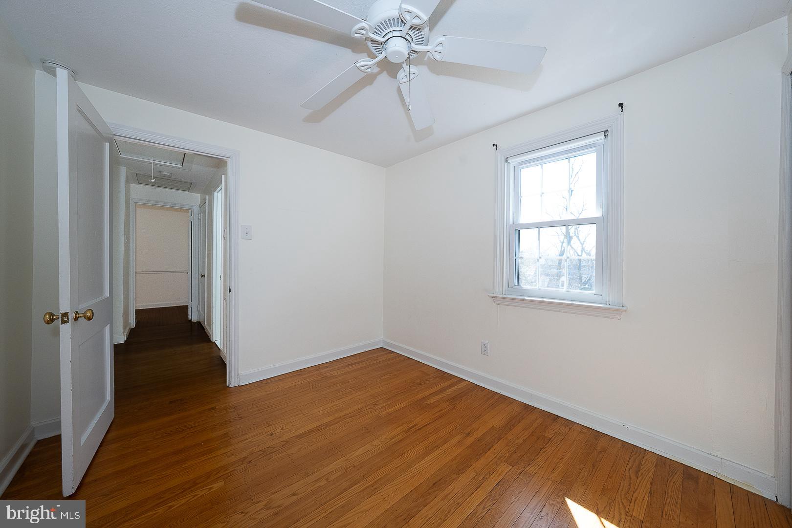 128 Homestead Road Wayne, PA 19087 - Photo 20 of 30 wooden floor in an empty room with a window