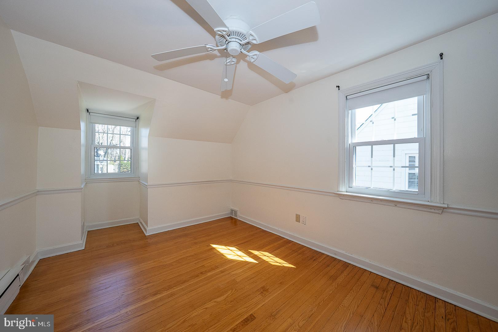 128 Homestead Road Wayne, PA 19087 - Photo 25 of 30 a view of empty room with wooden floor and fan