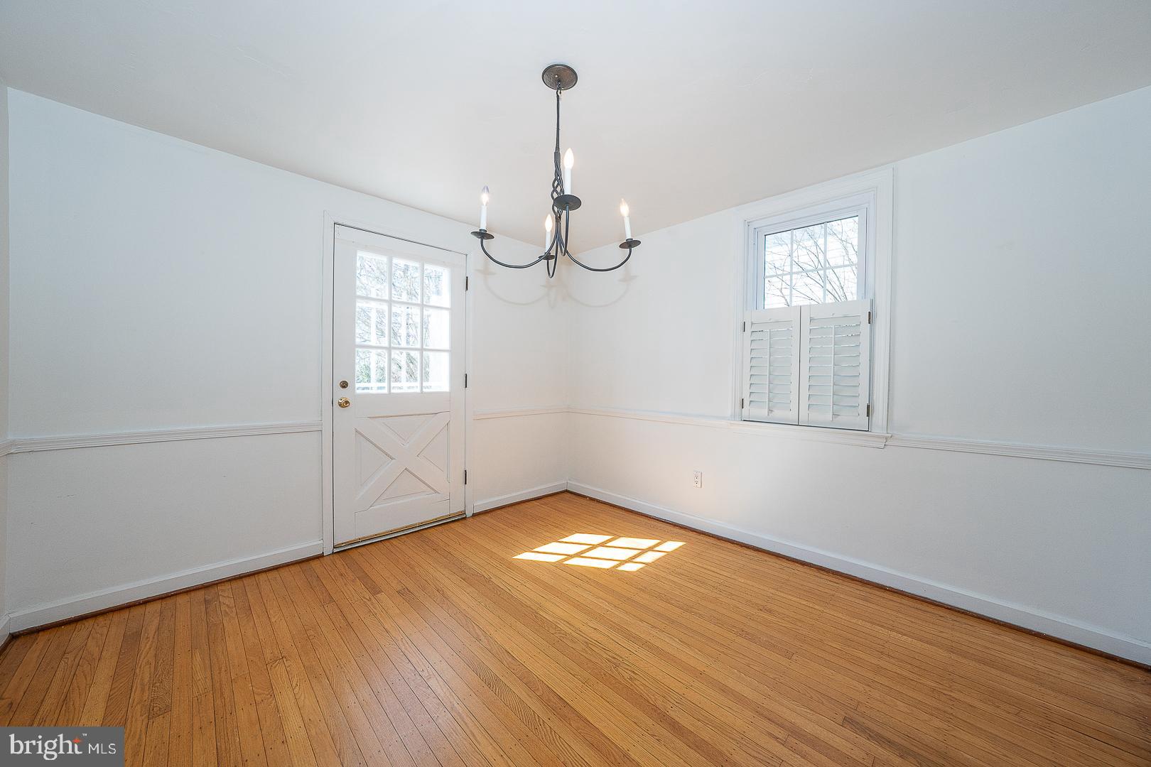 128 Homestead Road Wayne, PA 19087 - Photo 6 of 30 a view of empty room with wooden floor and fan