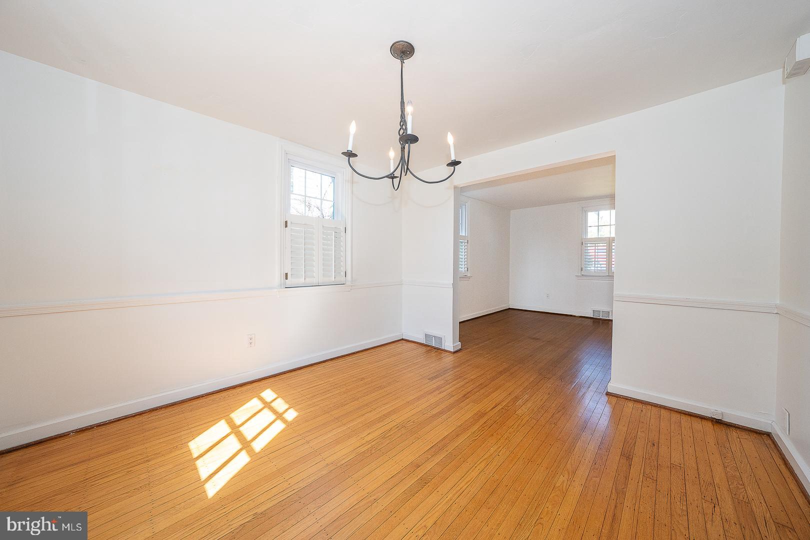 128 Homestead Road Wayne, PA 19087 - Photo 7 of 30 a view of empty room with wooden floor and fan