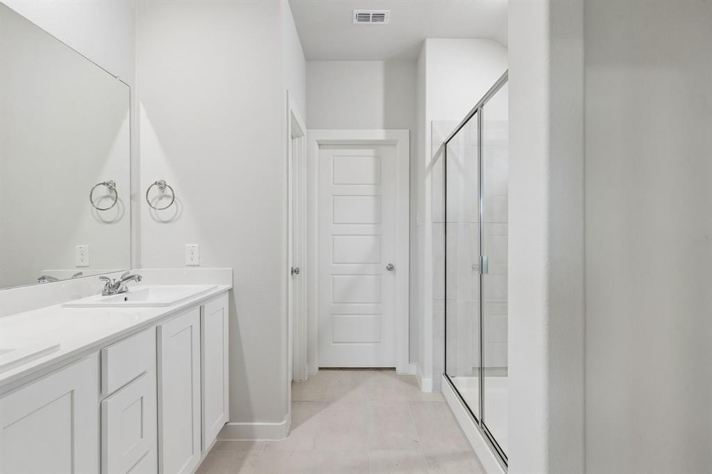 1428 Companero Street Haslet, TX 76052 - Photo 19 of 33 Primary Bathroom in the Oscar home plan by Trophy Signature Homes – REPRESENTATIVE PHOTO