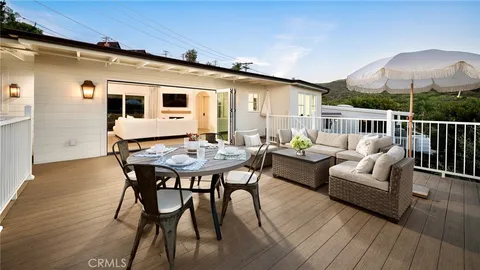 a view of a patio with furniture