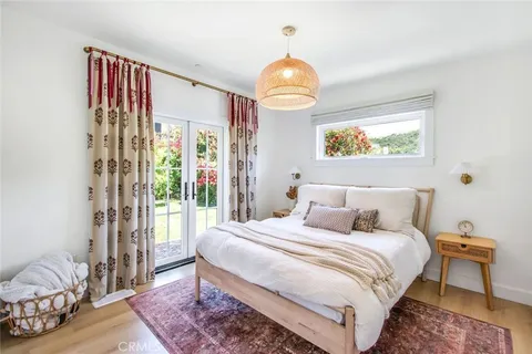 a bedroom with bed and a window