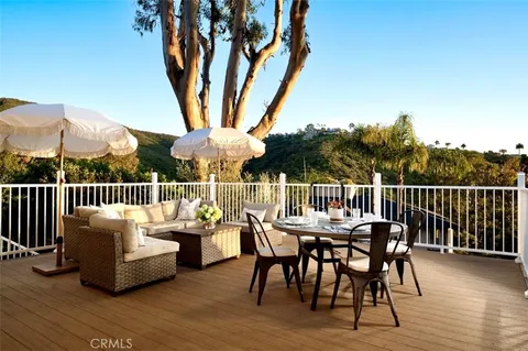 a view of a chairs and table in the deck