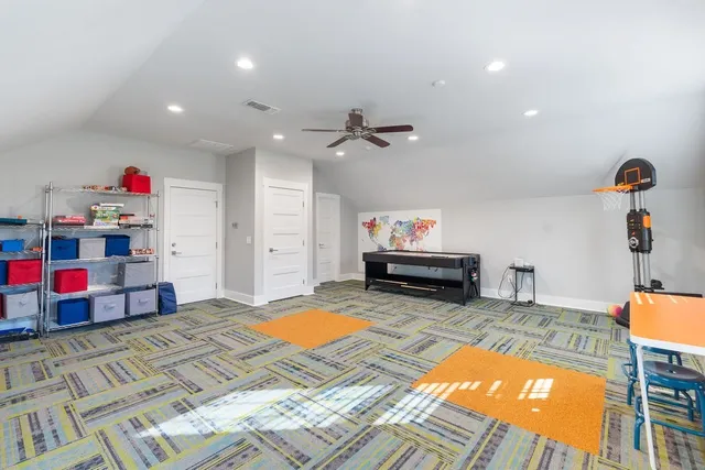 a bed room with a bed and a chandelier