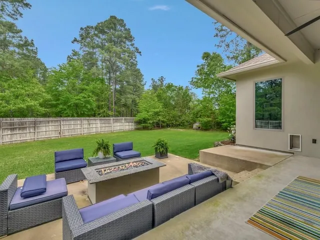 a view of a yard with furniture