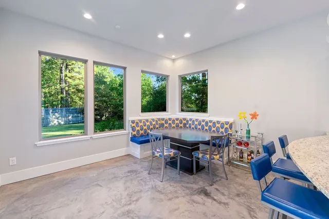 a view of a dining room with furniture window and outdoor view