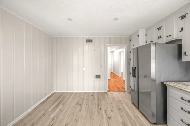 a view of kitchen with wooden floor and window