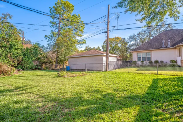 a view of a swimming pool with an outdoor space and seating area