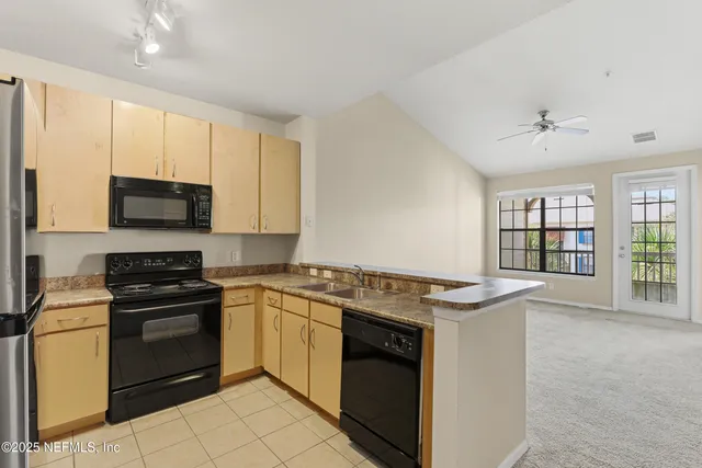 a kitchen with a stove and a microwave