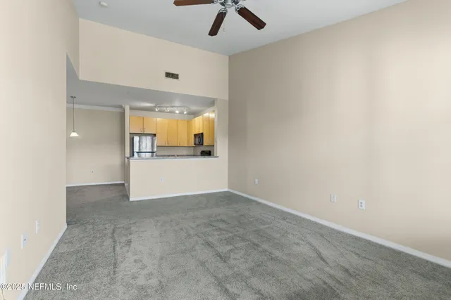 a view of a kitchen with a sink and a cabinet