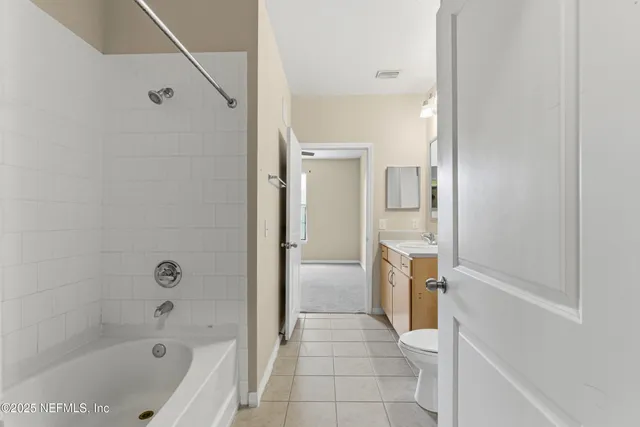 a bathroom with a bathtub sink and toilet
