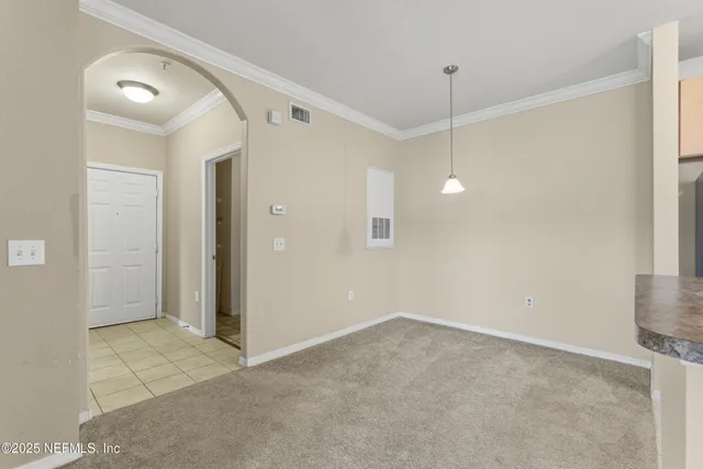 a view of a room with a sink and a mirror