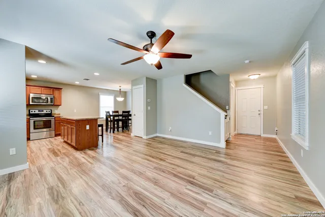 a view of kitchen with furniture and wooden floor