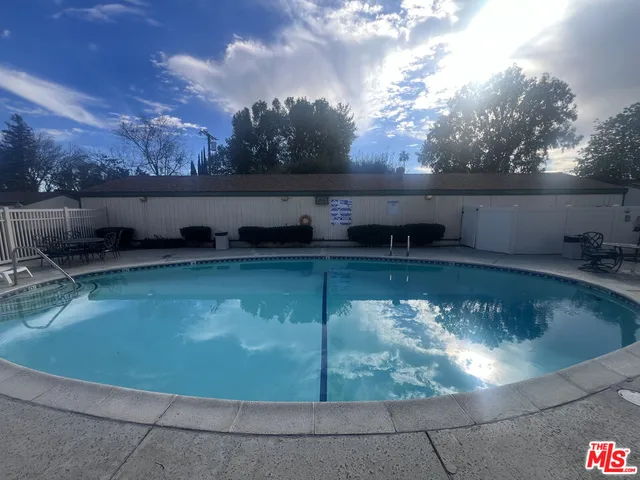 a view of a swimming pool with an outdoor space