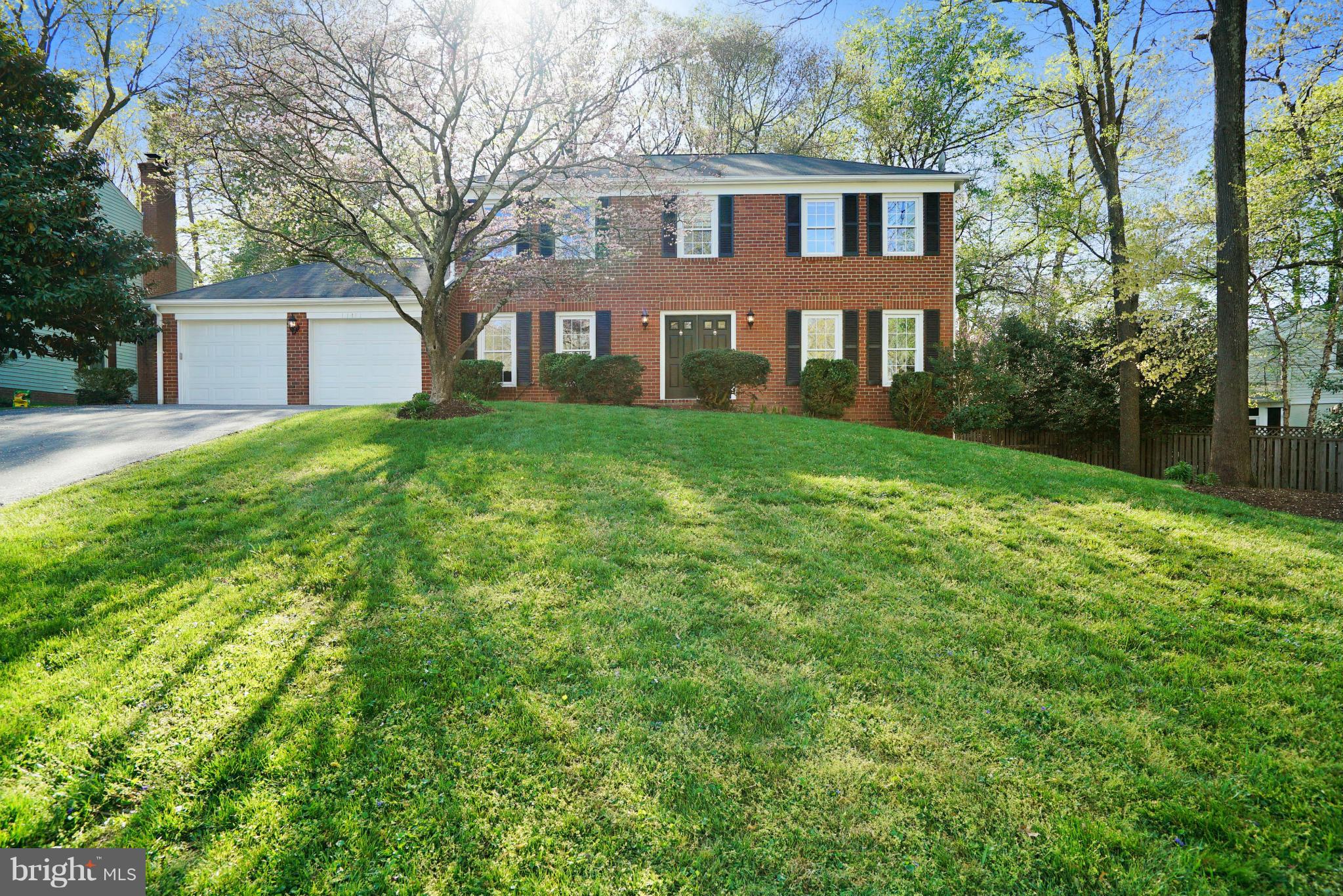 11811 Grey Birch Place Reston, VA 20191 - Photo 1 of 30 a front view of a house with yard and trees