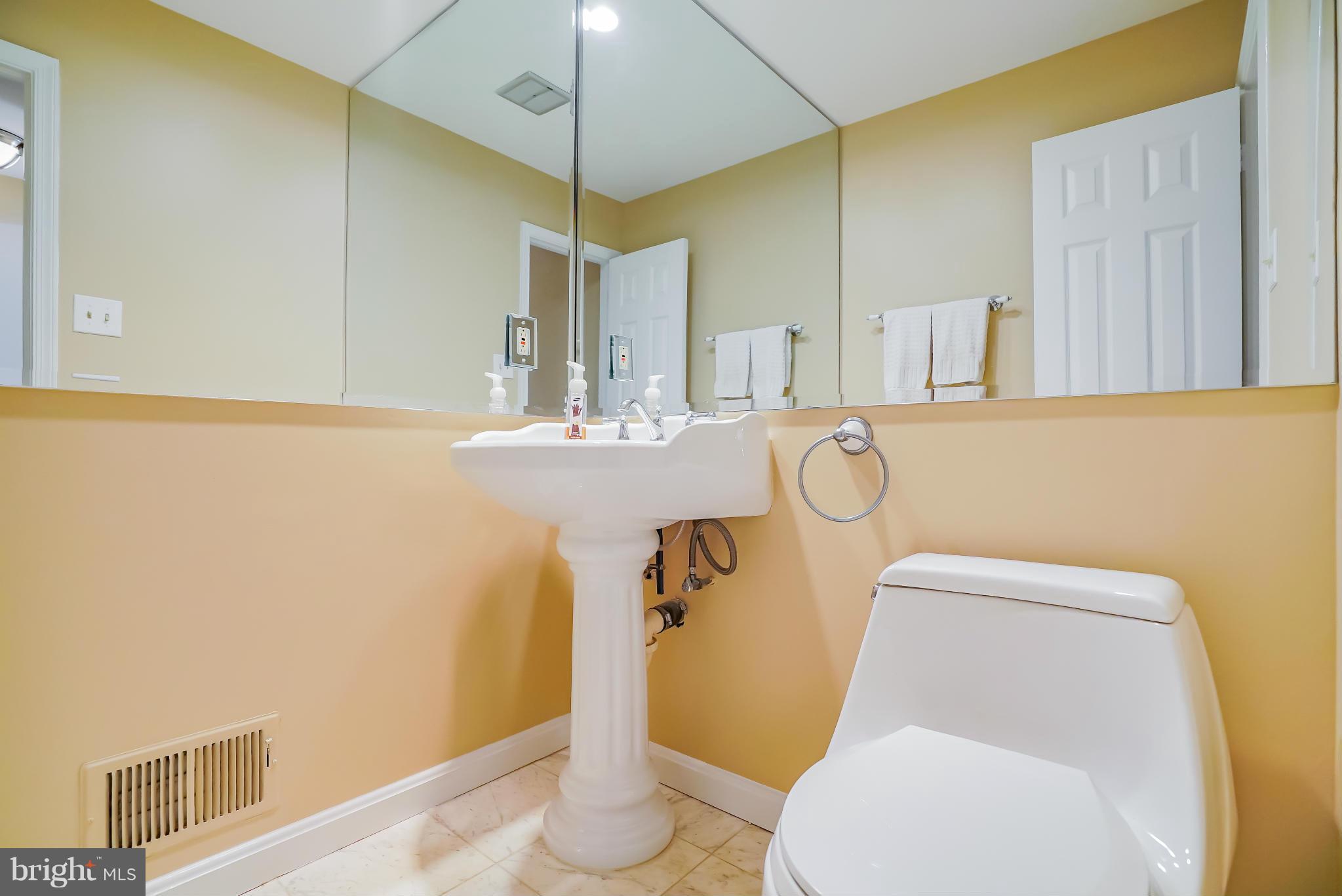 11811 Grey Birch Place Reston, VA 20191 - Photo 14 of 30 a bathroom with a toilet and a sink