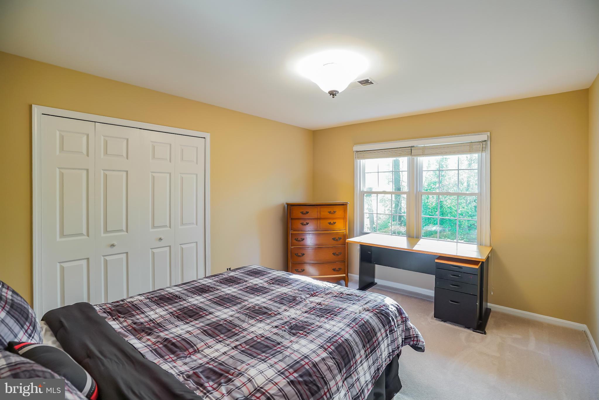 11811 Grey Birch Place Reston, VA 20191 - Photo 18 of 30 a bedroom with a bed and a window