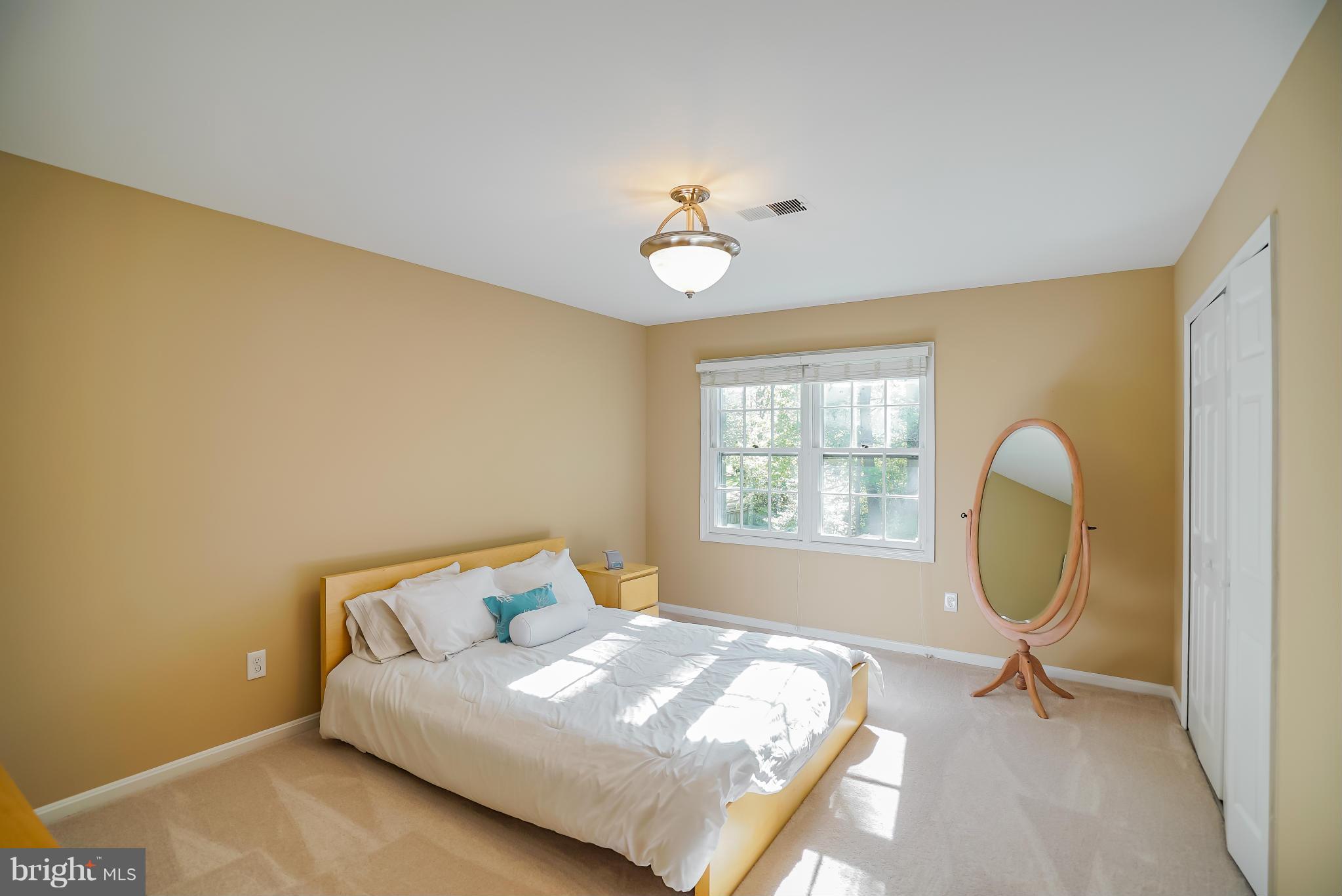 11811 Grey Birch Place Reston, VA 20191 - Photo 19 of 30 a bedroom with a bed and window