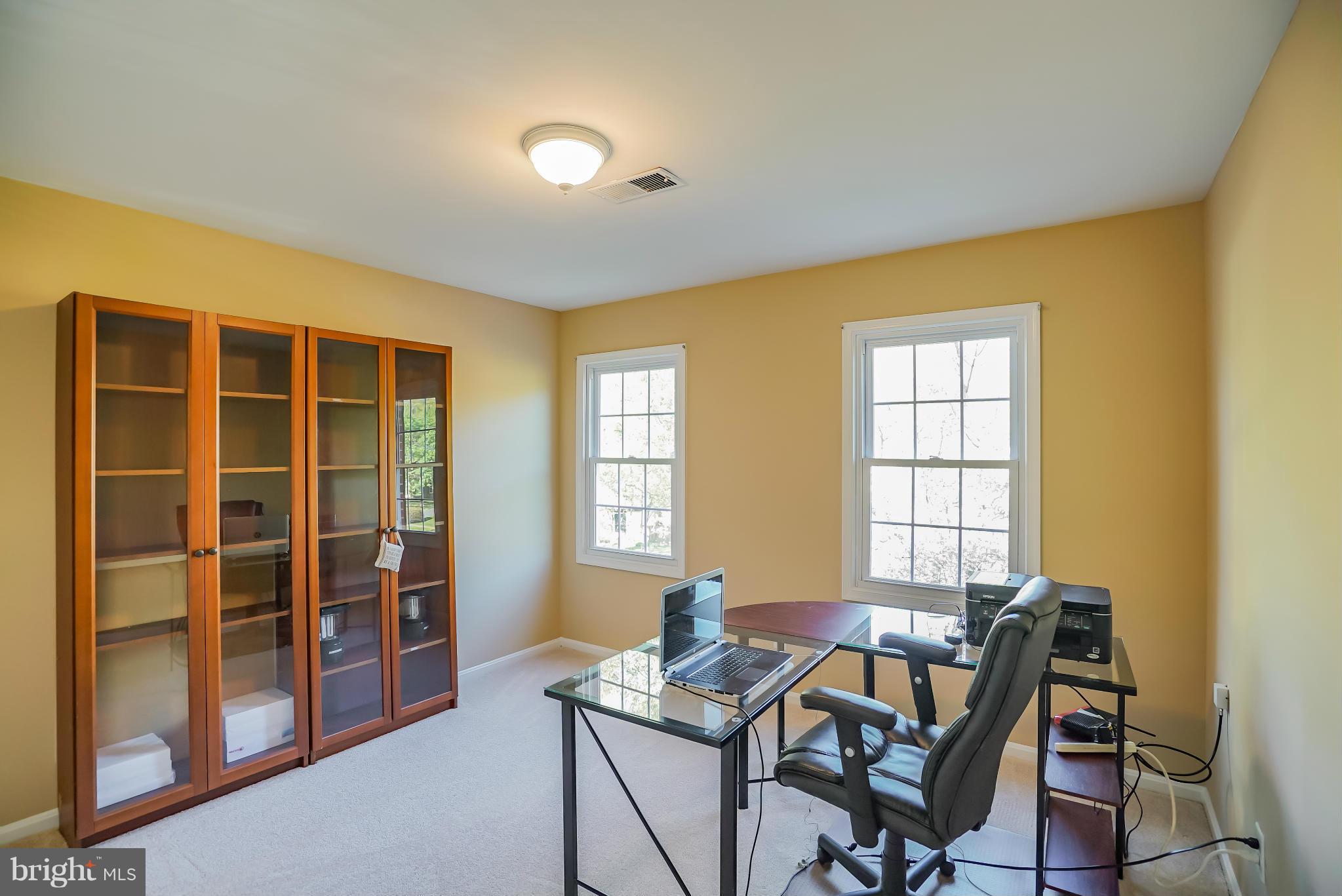 11811 Grey Birch Place Reston, VA 20191 - Photo 20 of 30 a view of a workspace with furniture and a window