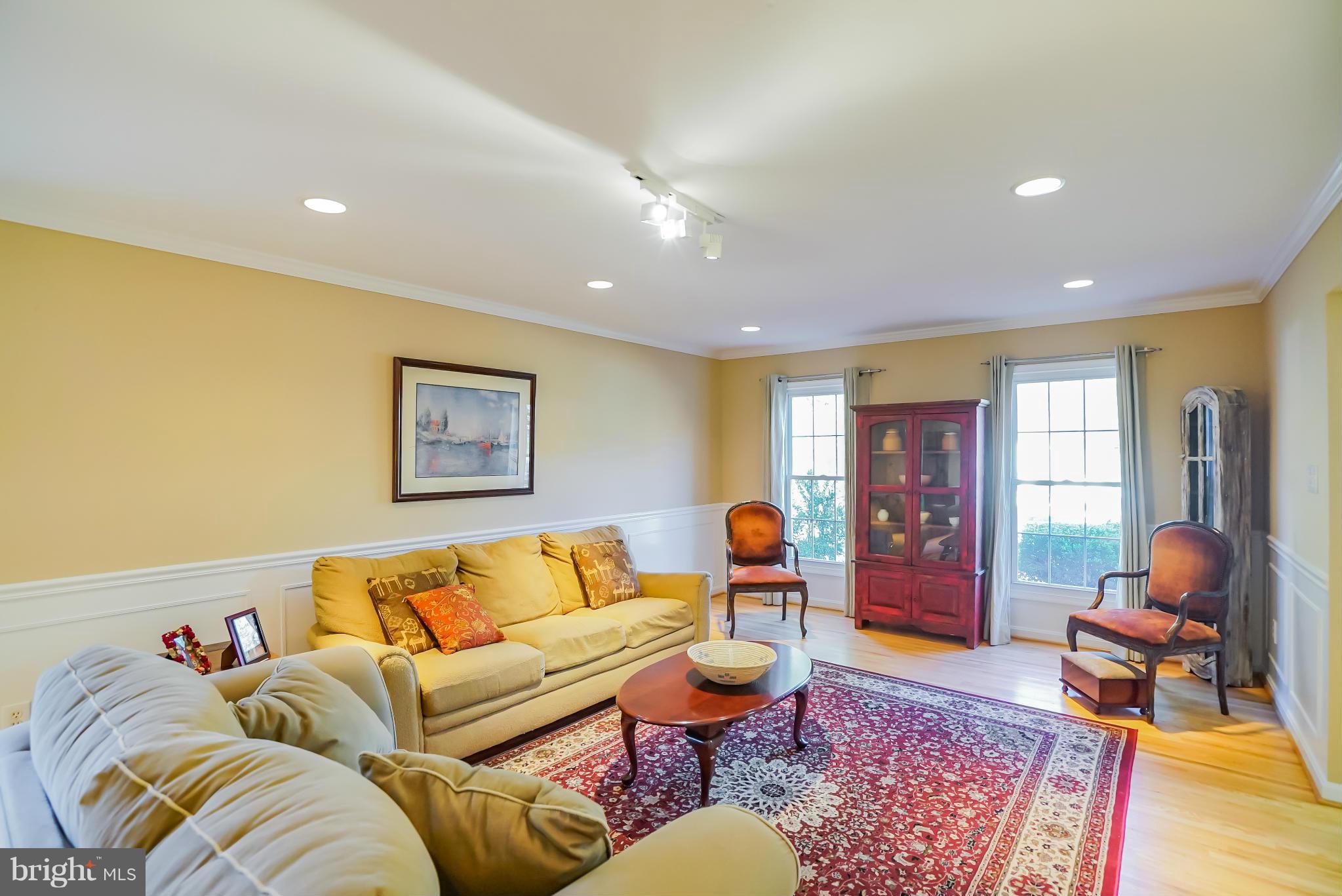 11811 Grey Birch Place Reston, VA 20191 - Photo 4 of 30 a living room with furniture a rug and a window