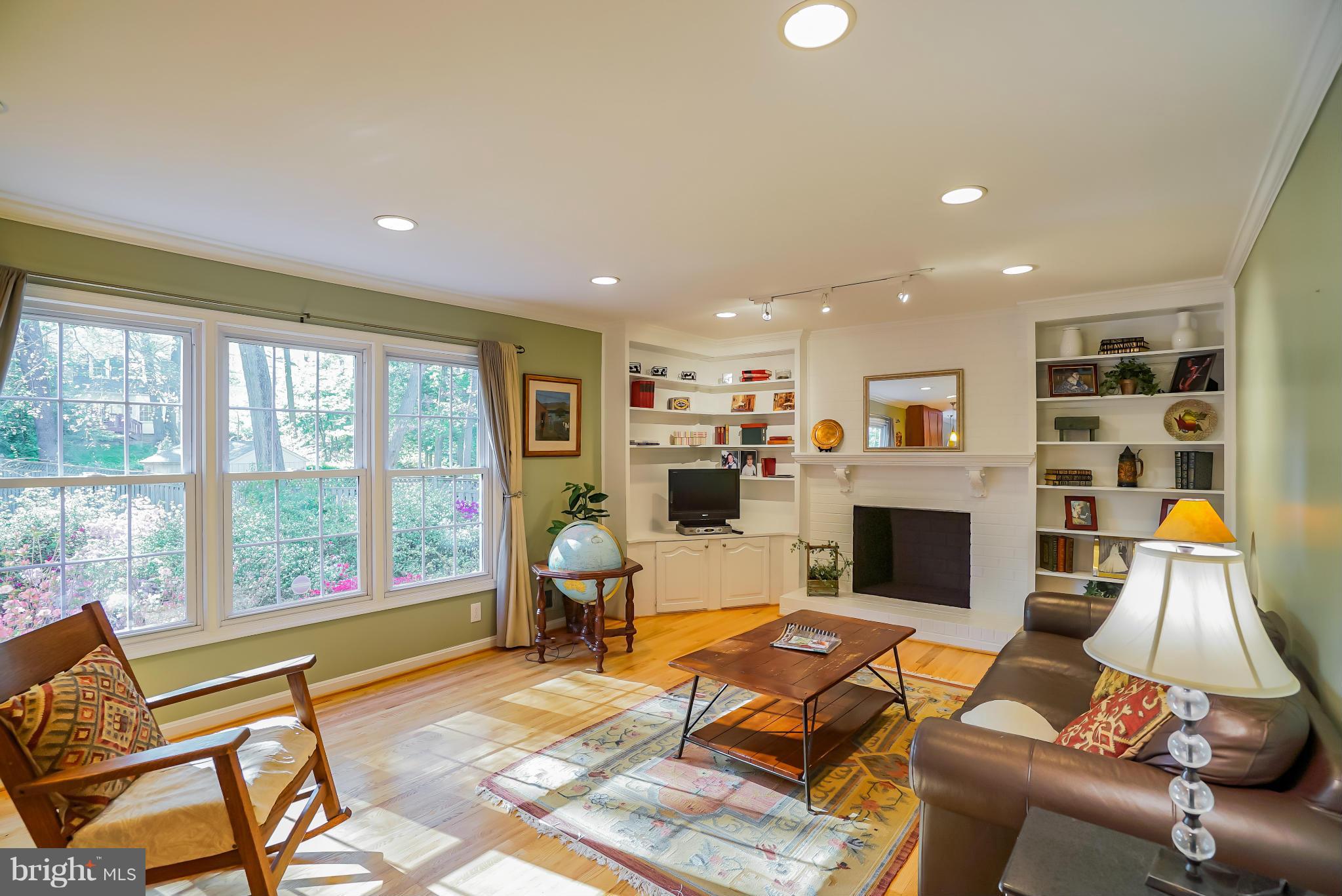 11811 Grey Birch Place Reston, VA 20191 - Photo 7 of 30 a living room with furniture a rug and a fireplace