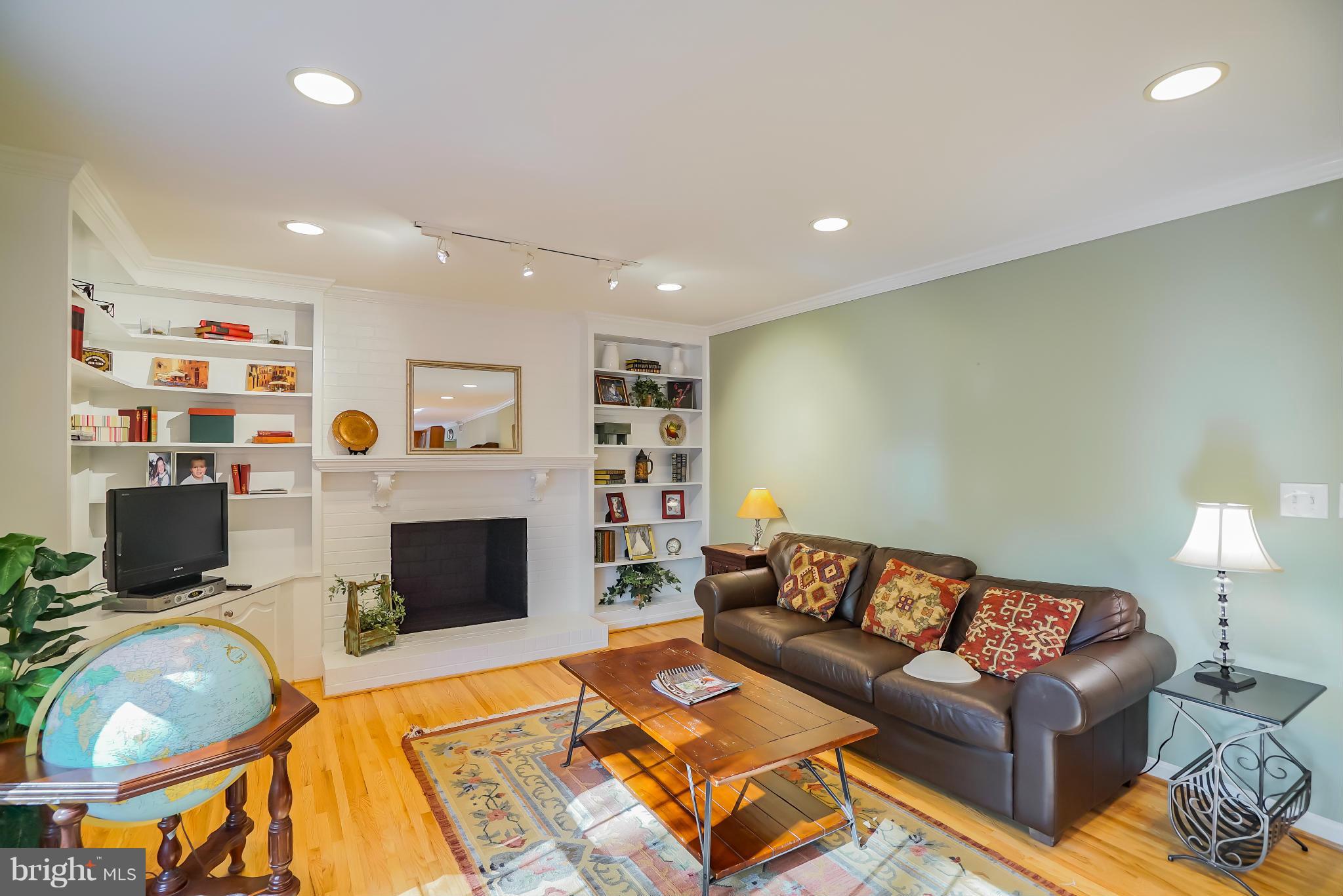 11811 Grey Birch Place Reston, VA 20191 - Photo 8 of 30 a living room with furniture and a fireplace