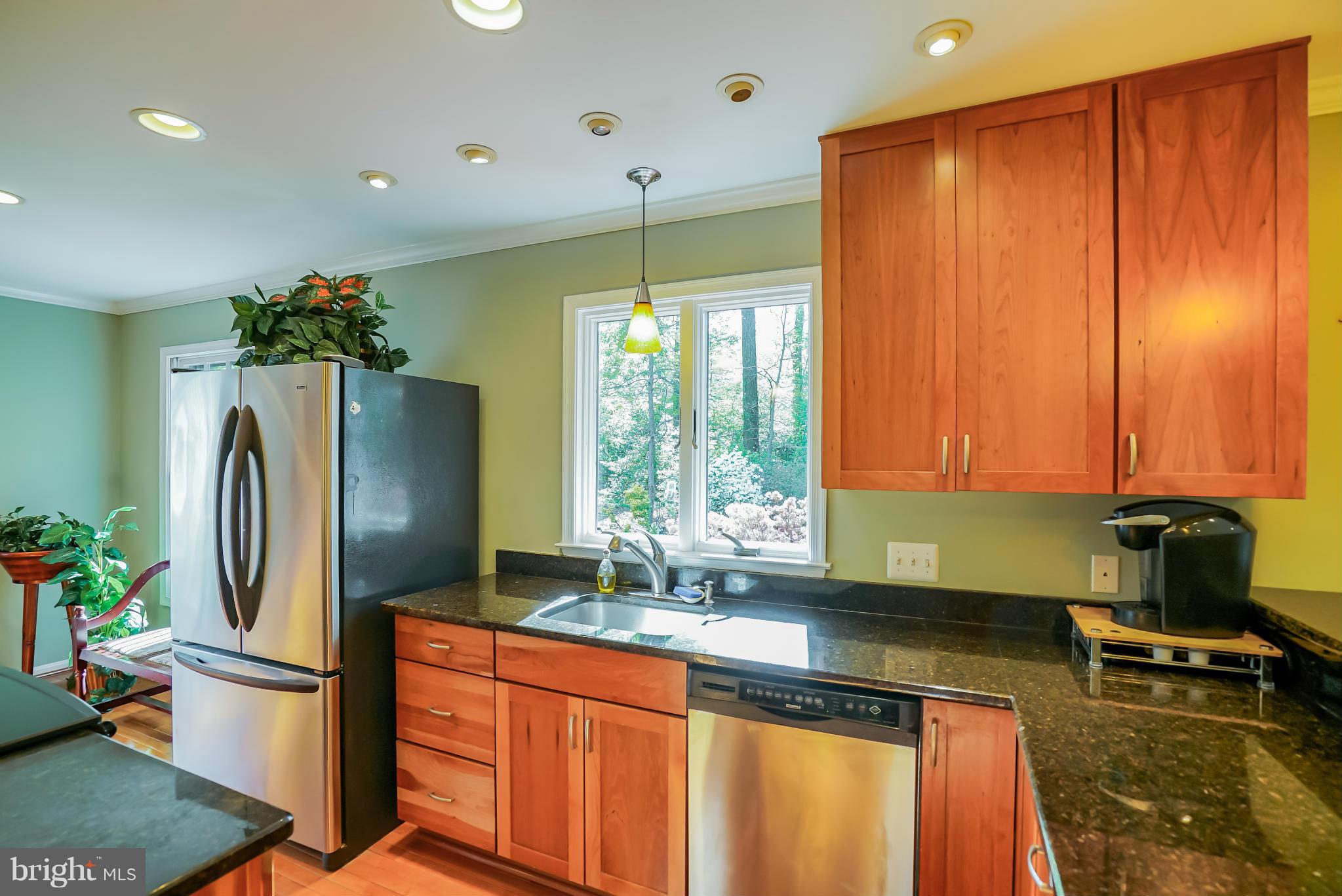 11811 Grey Birch Place Reston, VA 20191 - Photo 10 of 30 a kitchen with stainless steel appliances granite countertop a refrigerator and a sink