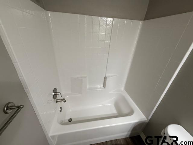 1714 Pine Crest Drive, Unit 103 Tyler, TX 75701 - Photo 4 of 11 a bathroom with a tub and toilet