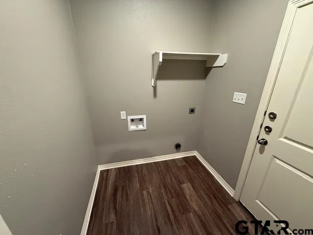 a view of a small space with wooden floor and a ceiling fan