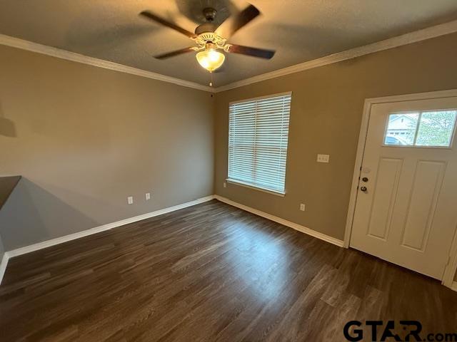 1714 Pine Crest Drive, Unit 103 Tyler, TX 75701 - Photo 6 of 11 an empty room with wooden floor fan and windows