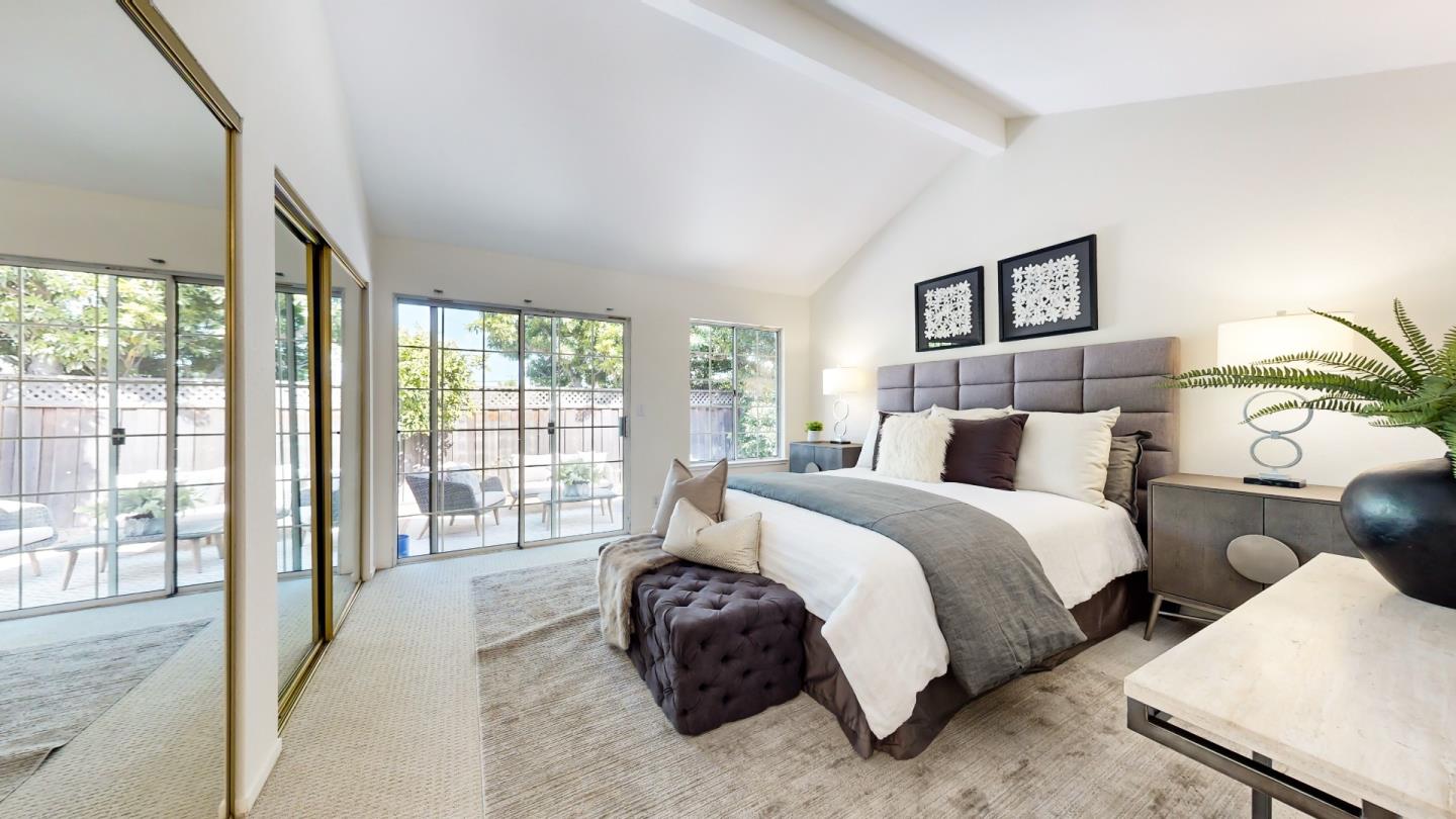 890 Windmill Park Lane Mountain View, CA 94043 - Photo 15 of 27 a spacious bedroom with a bed and a large window
