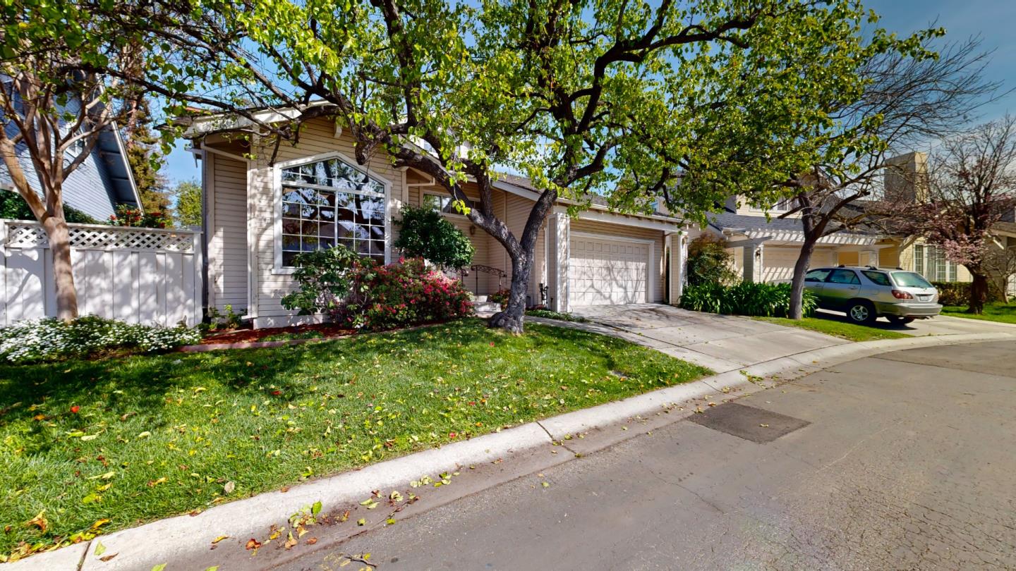 890 Windmill Park Lane Mountain View, CA 94043 - Photo 2 of 27 a front view of a house with a yard and a garage
