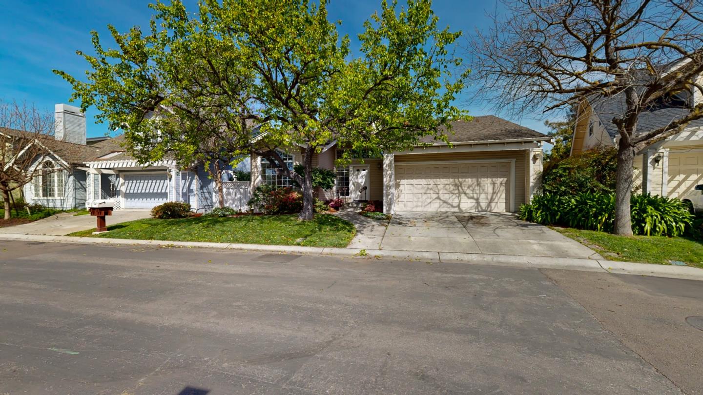 890 Windmill Park Lane Mountain View, CA 94043 - Photo 25 of 27 a front view of a house with a yard and garage
