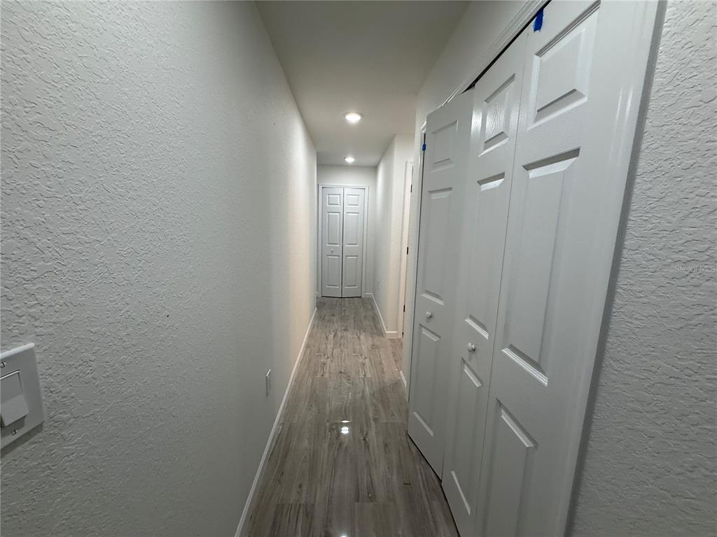 5358 Rhapsody Avenue North Port, FL 34288 - Photo 20 of 28 a view of hallway with wooden floor
