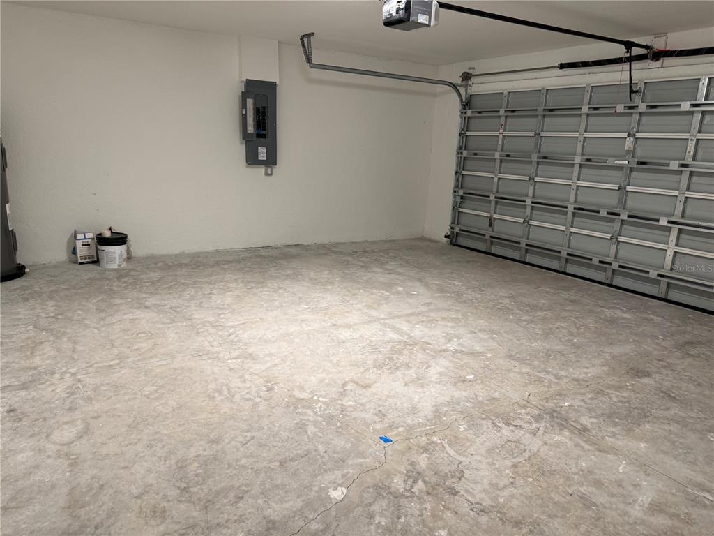 5358 Rhapsody Avenue North Port, FL 34288 - Photo 21 of 28 a view of a garage with an empty space