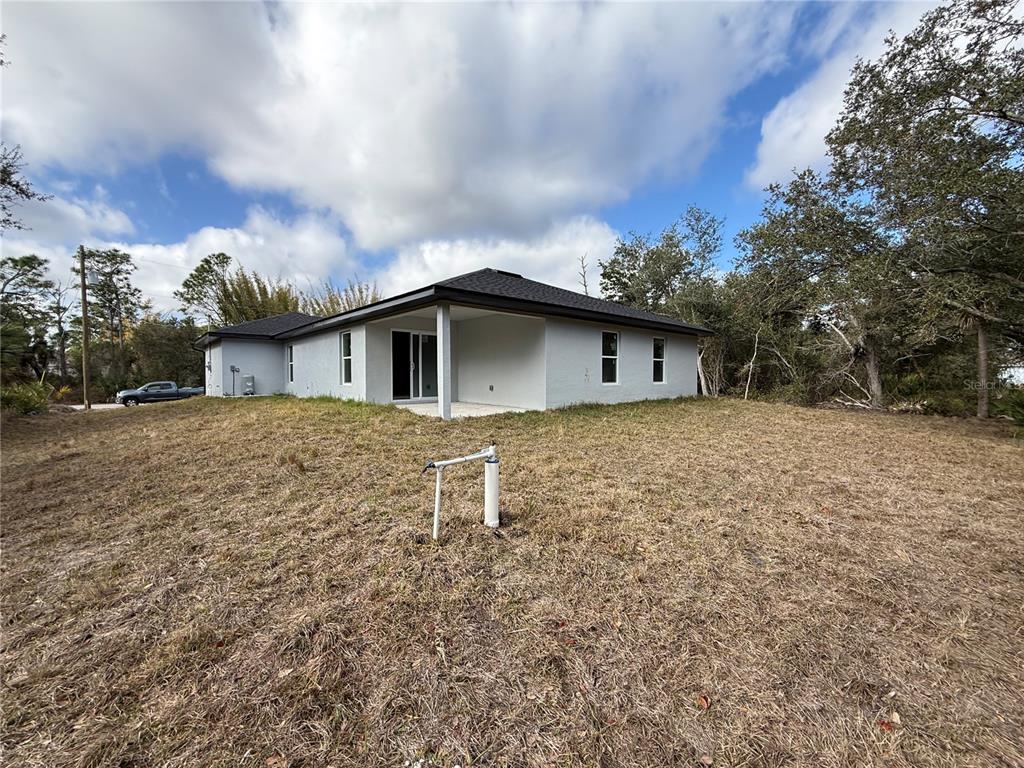 5358 Rhapsody Avenue North Port, FL 34288 - Photo 24 of 28 a house with trees in the background