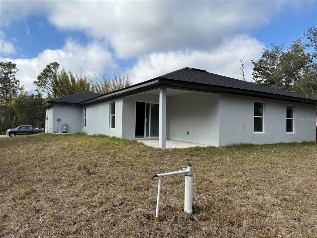 5358 Rhapsody Avenue North Port, FL 34288 - Photo 25 of 28 a backyard of a house with lots of green space