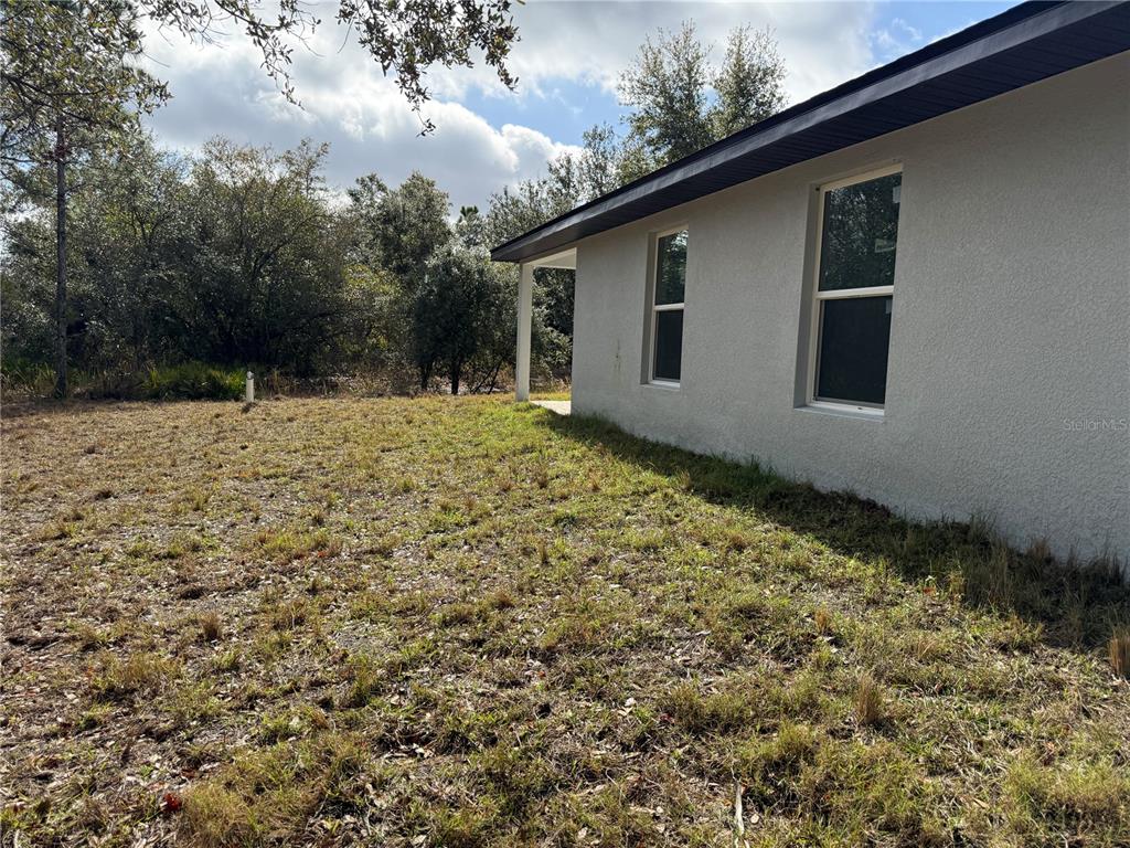 5358 Rhapsody Avenue North Port, FL 34288 - Photo 27 of 28 a house with trees in the background