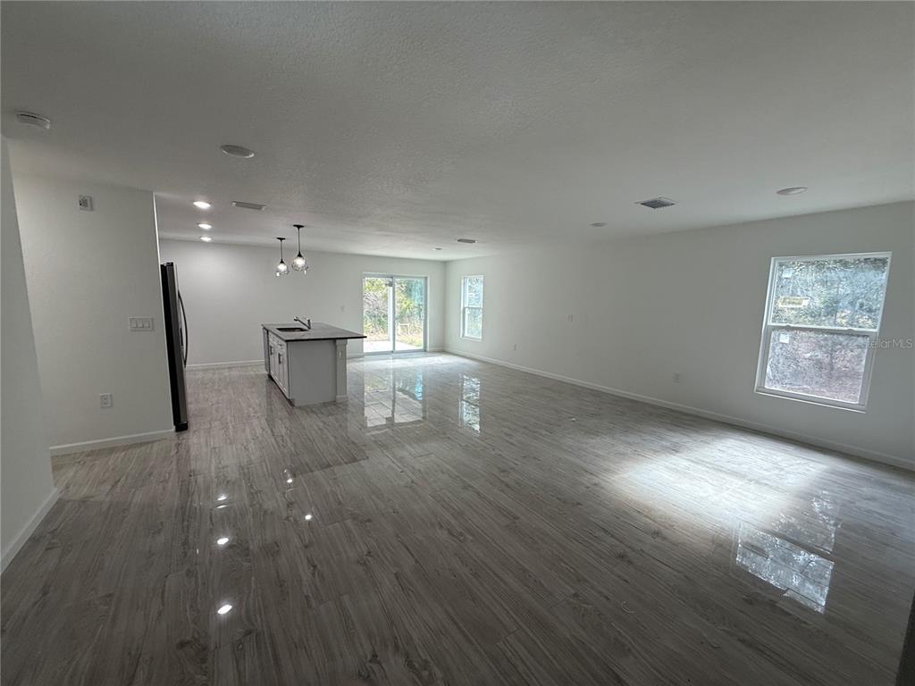 5358 Rhapsody Avenue North Port, FL 34288 - Photo 4 of 28 a view of a living room and wooden floor