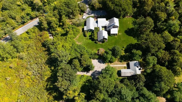 a front view of a house with a yard and porch