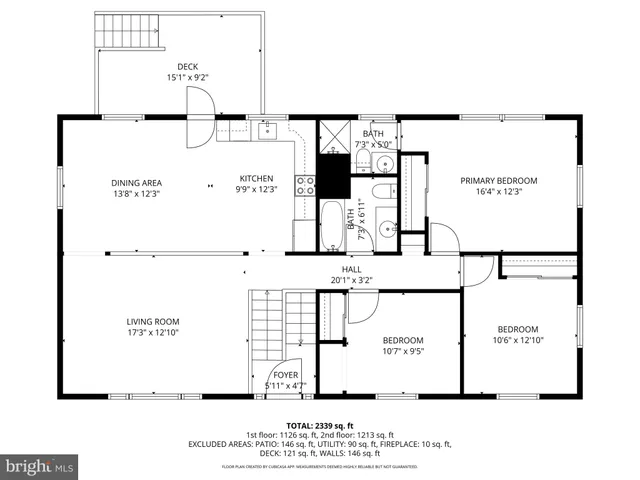 wooden floor fireplace and windows in an empty room
