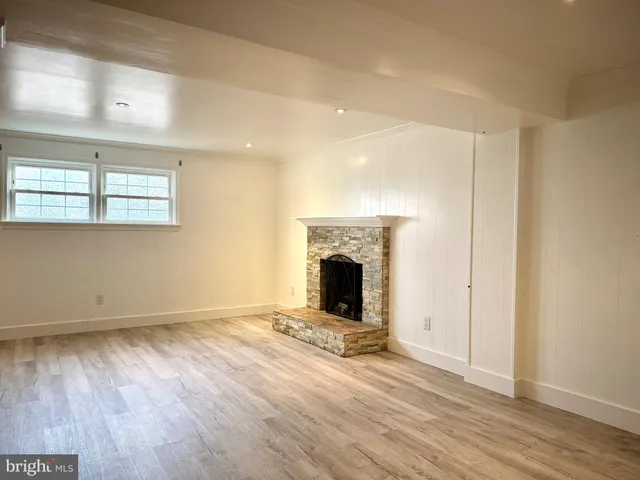 a kitchen with granite countertop wooden floors and stainless steel appliances