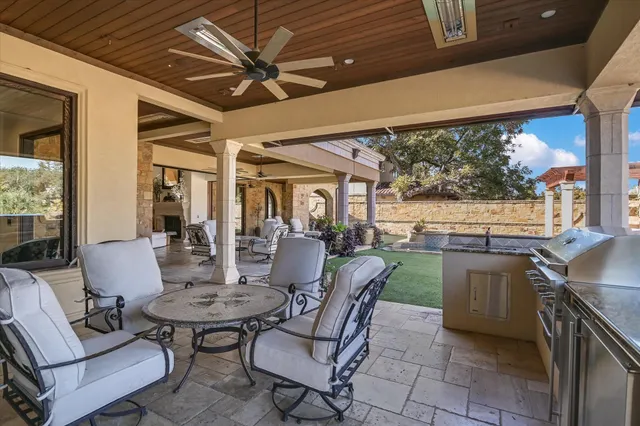 a dining room with furniture a rug and a large window