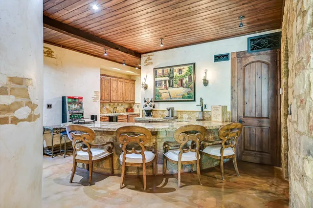 a dining table with chairs and window