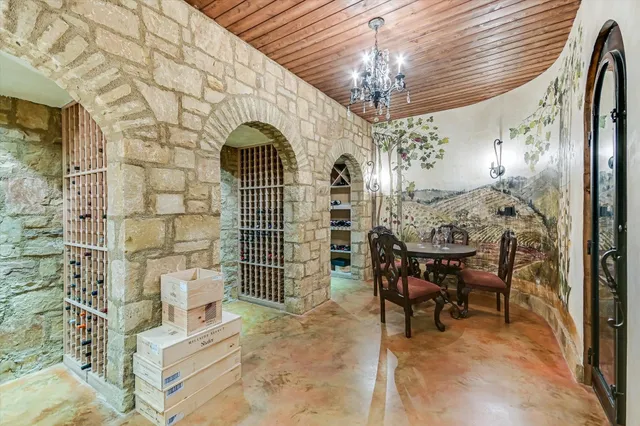 a view of a livingroom with furniture and chandelier