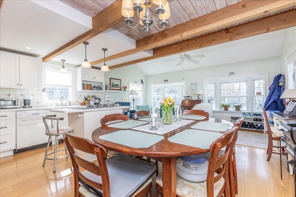 145 Evans Rd Extension Marblehead, MA 01945 - Photo 13 of 42 a dining room with stainless steel appliances kitchen island a table and chairs